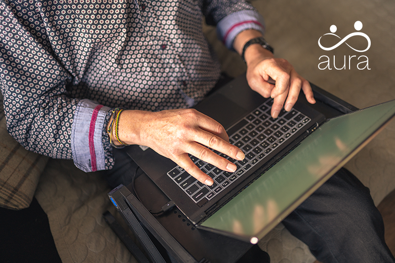 Man sitting at laptop and typing